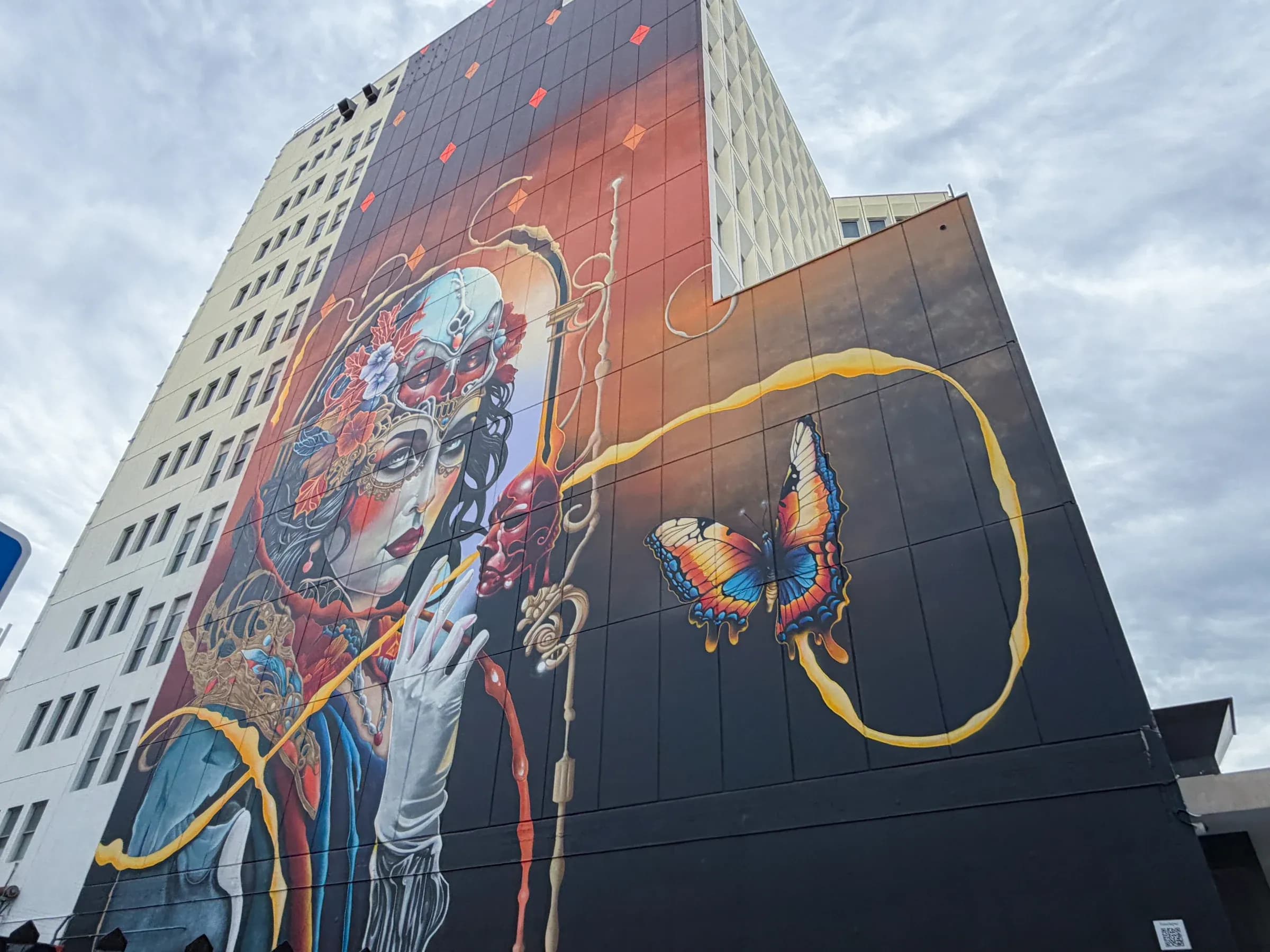 A towering mural brings colour to the city.